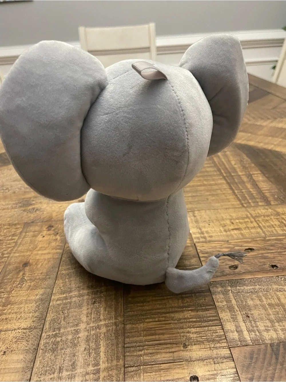 Amscan plush elephant balloon weight featuring blue ears and blue feet